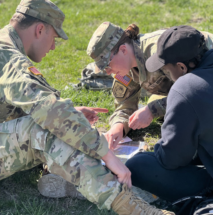 Three CDTs looking at a map